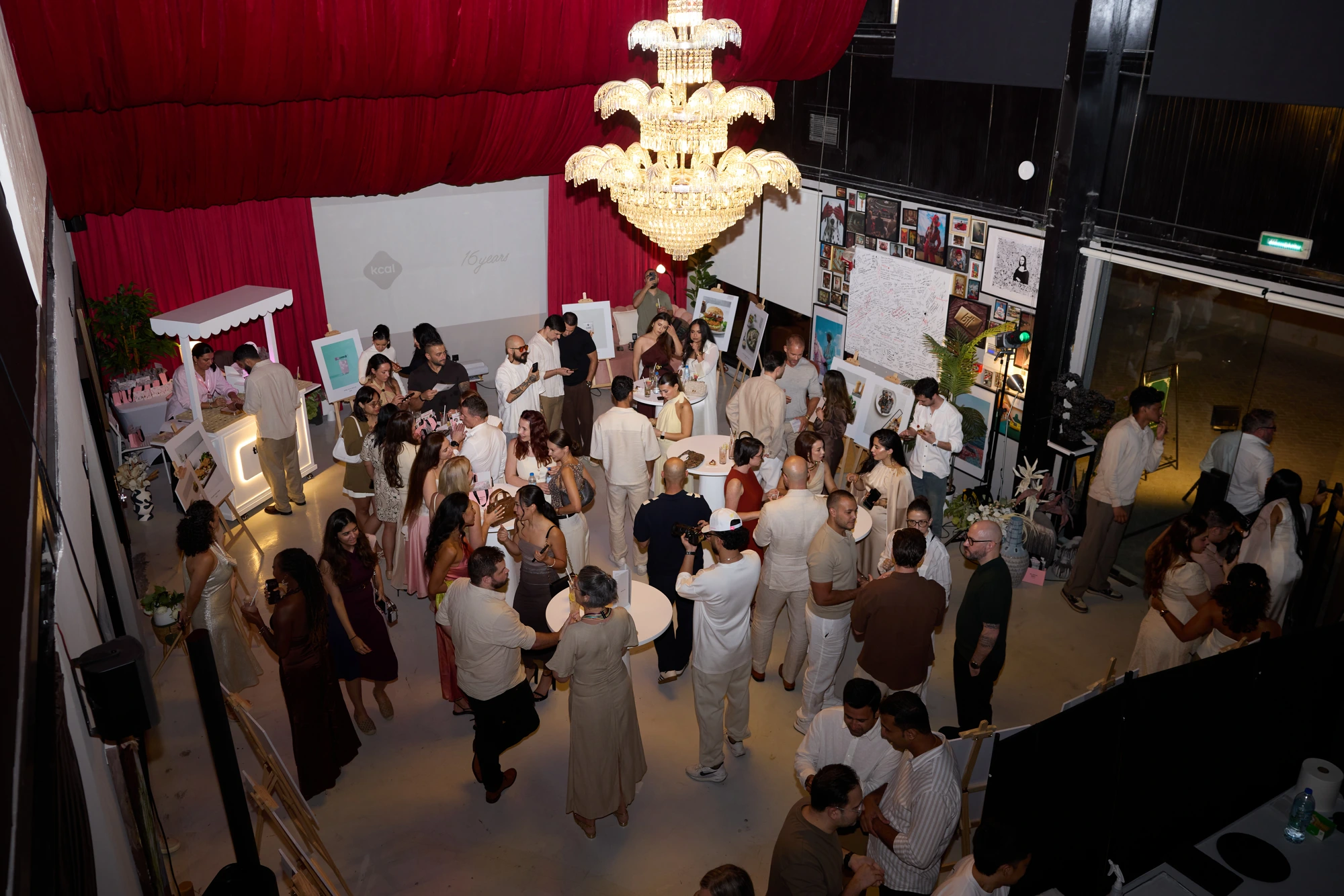 Guests enjoying a private event under the high ceiling at Velvet